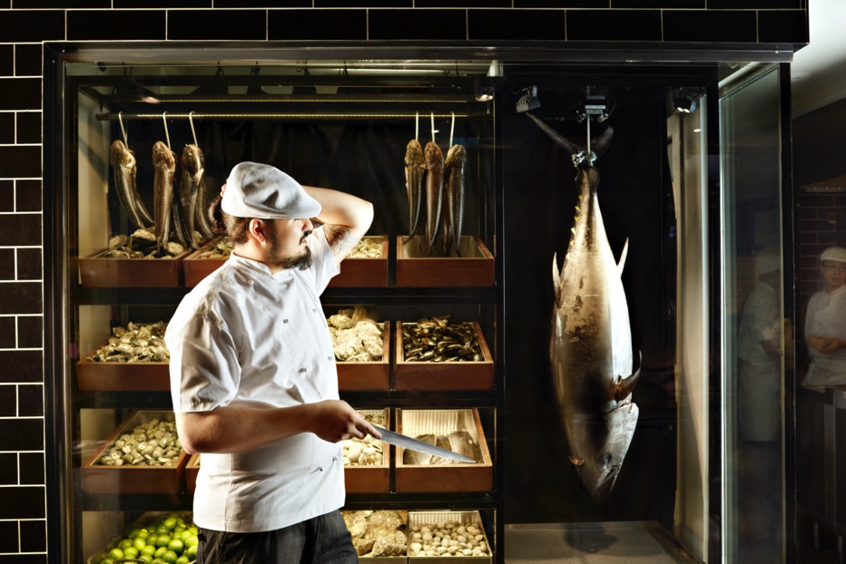 Chef with fish at Robert-marchetti-QT-Hotel-Sydney